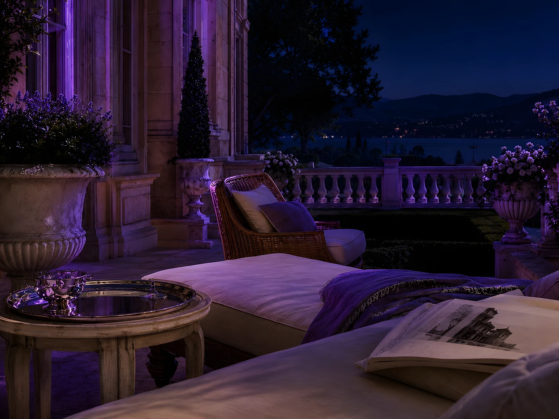 An estate terrace after dark, lit in violet, with a wicker chair, a silver tray and a view over a lake